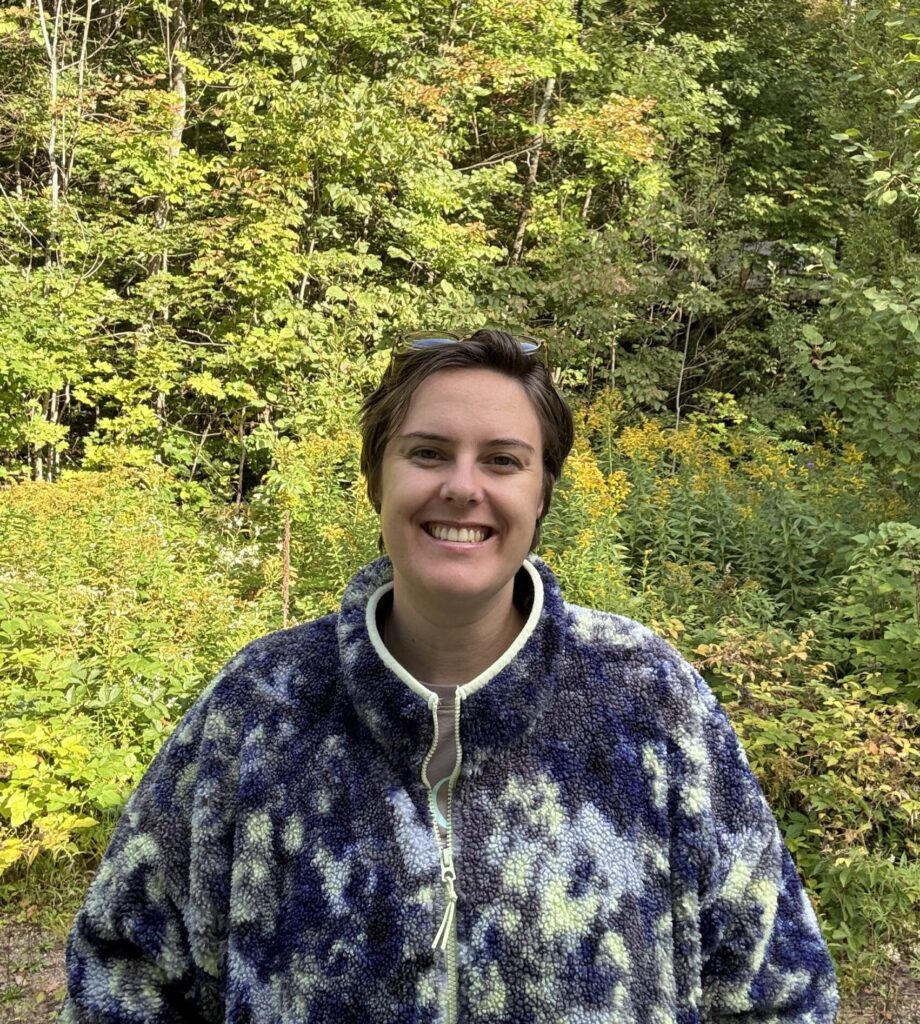 Photo of KOC Operations Manager in front of a background of trees